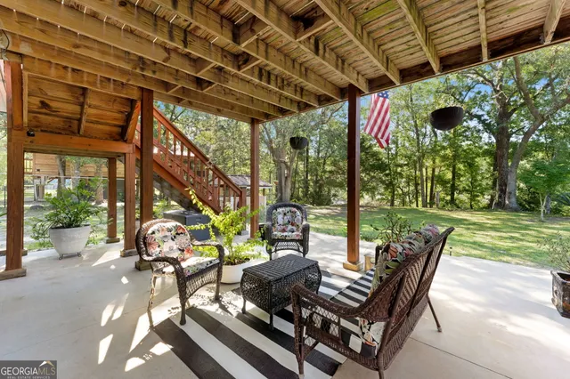a living room with furniture and a rug