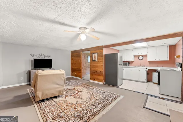 a kitchen with a stove a refrigerator and a sink