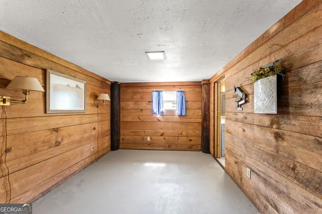 a view of a swimming pool with a table and chairs in patio