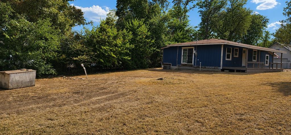 2016 Gavin Road Tool, TX 75143 - Photo 4 of 26 Side yard and irrigation well.