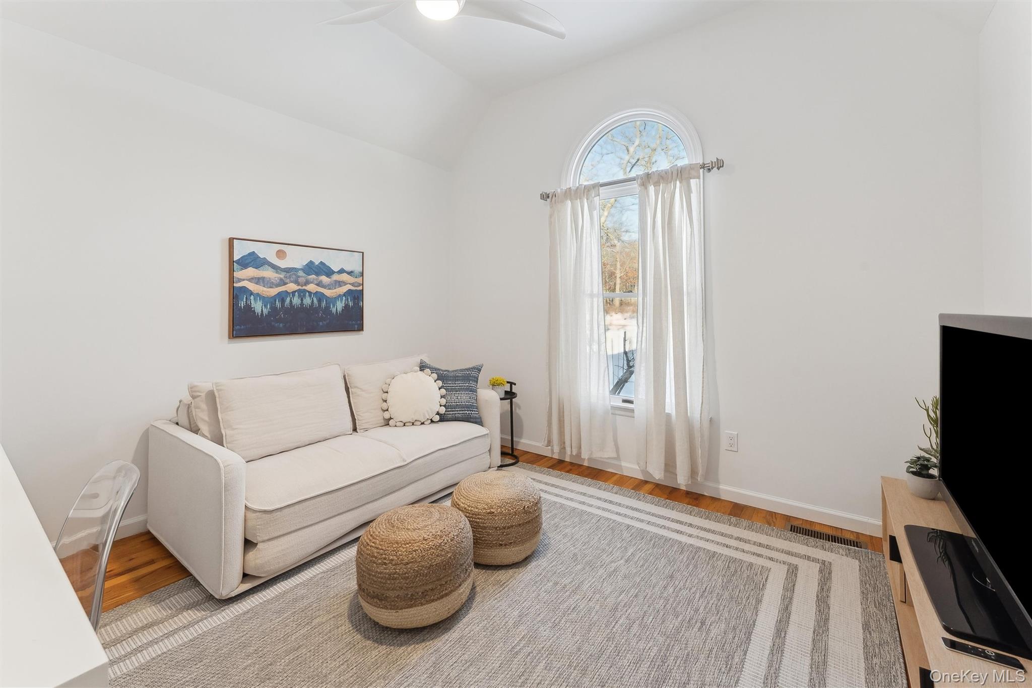 14 Hildreth Road Hampton Bays, NY 11946 - Photo 11 of 29 Living area featuring wood finished floors, and ceiling fan