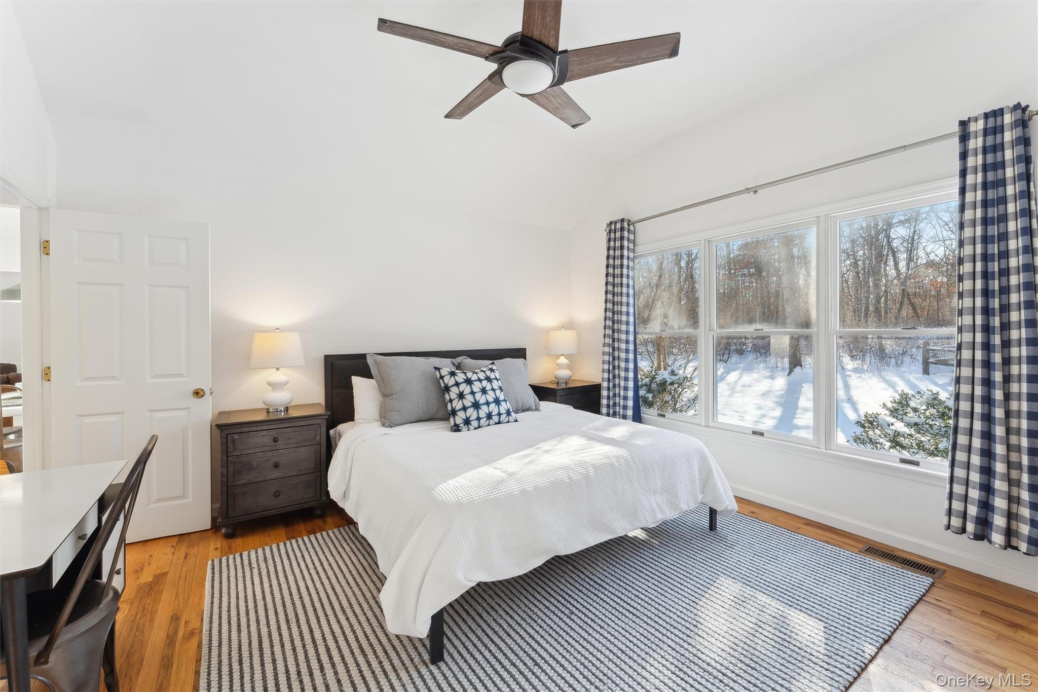 14 Hildreth Road Hampton Bays, NY 11946 - Photo 12 of 29 Bedroom with multiple windows and wood floors
