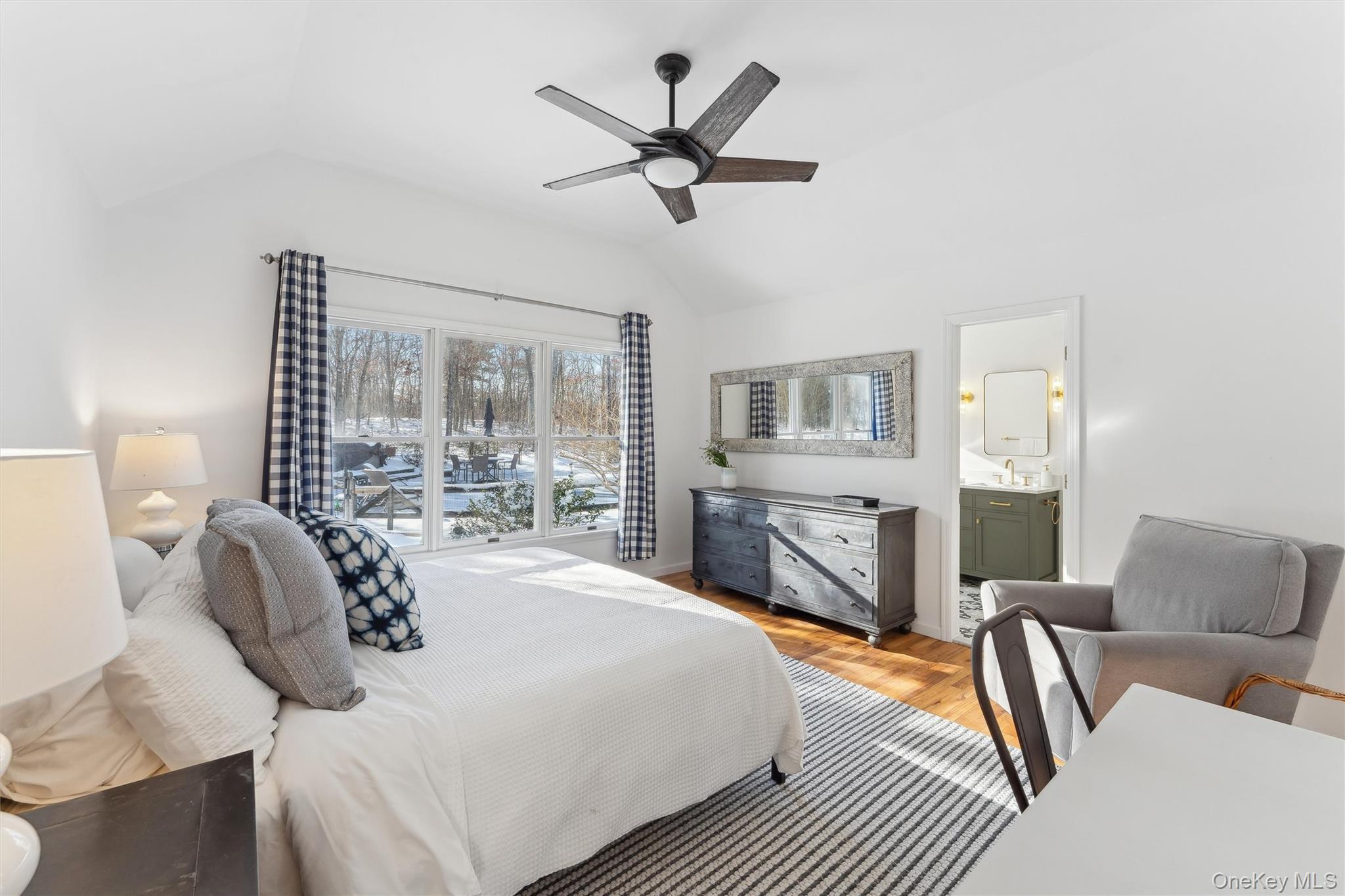 14 Hildreth Road Hampton Bays, NY 11946 - Photo 13 of 29 Bedroom with wood floors, a ceiling fan, a sink, and ensuite bath