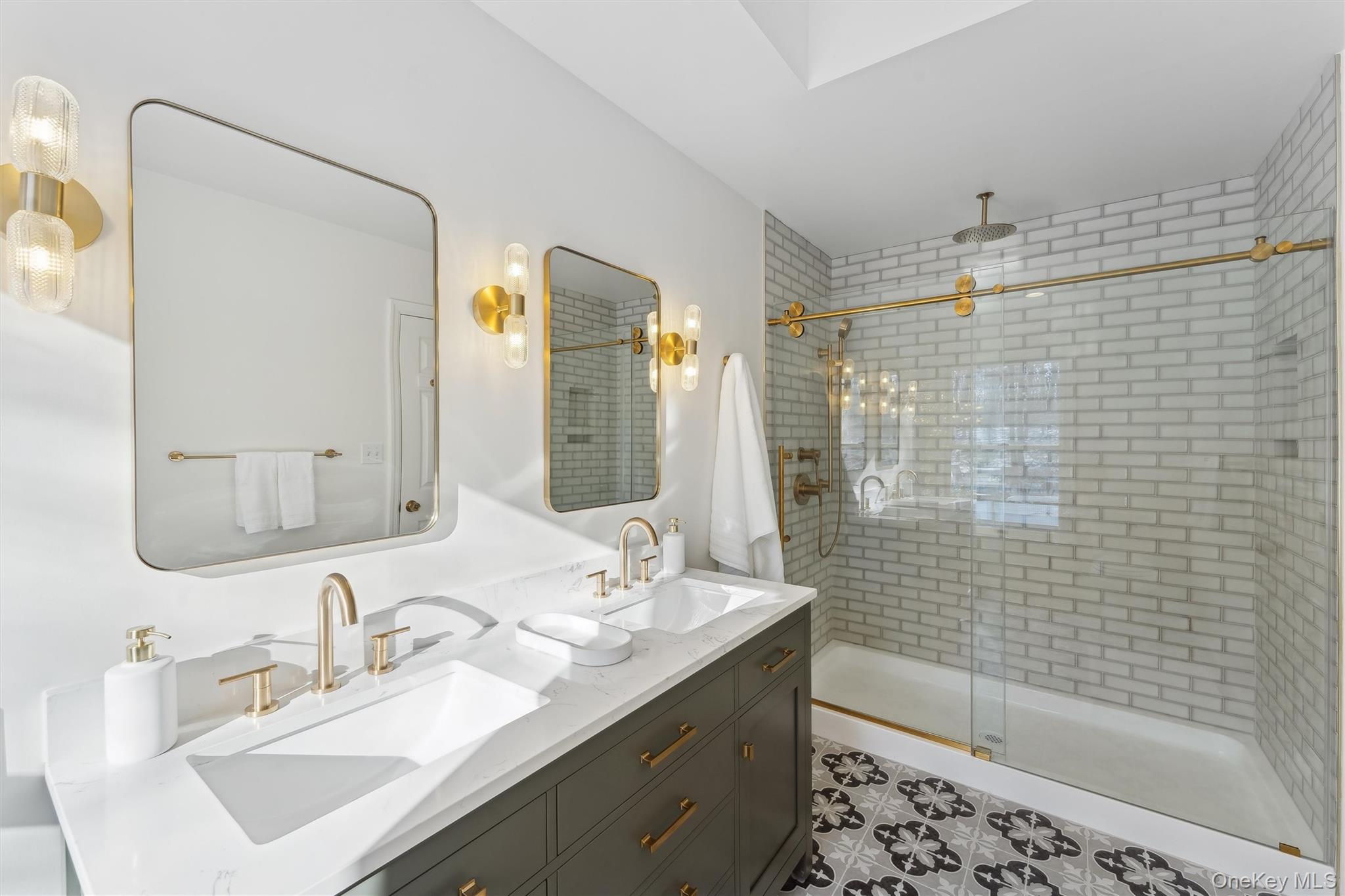 14 Hildreth Road Hampton Bays, NY 11946 - Photo 15 of 29 Full bathroom with double vanity, a sink, and a stall shower