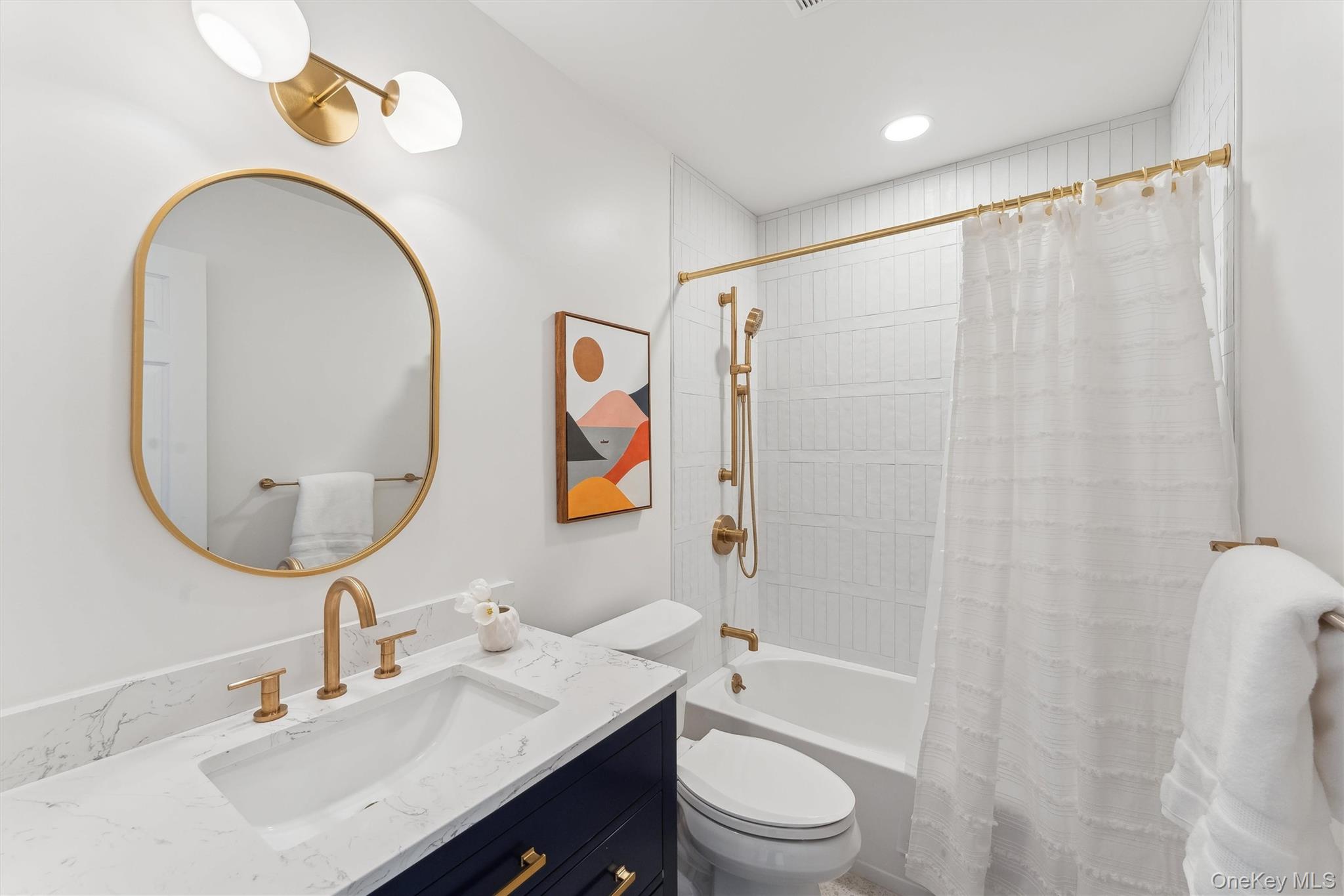 14 Hildreth Road Hampton Bays, NY 11946 - Photo 17 of 29 Full bathroom featuring toilet, shower / bath combo, and vanity