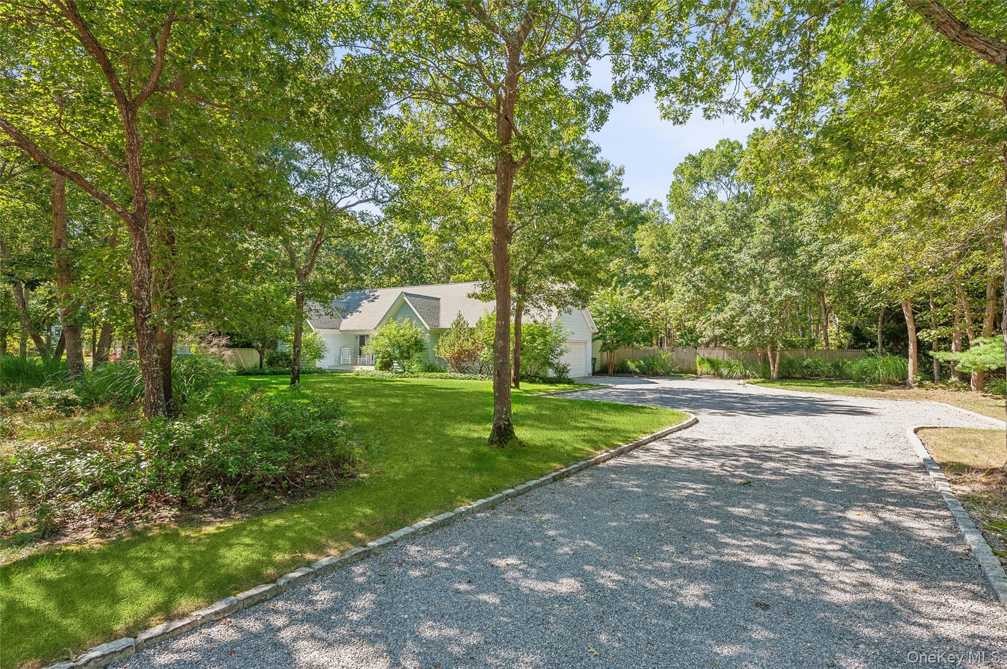 14 Hildreth Road Hampton Bays, NY 11946 - Photo 29 of 29 View of front facade featuring a front yard and driveway