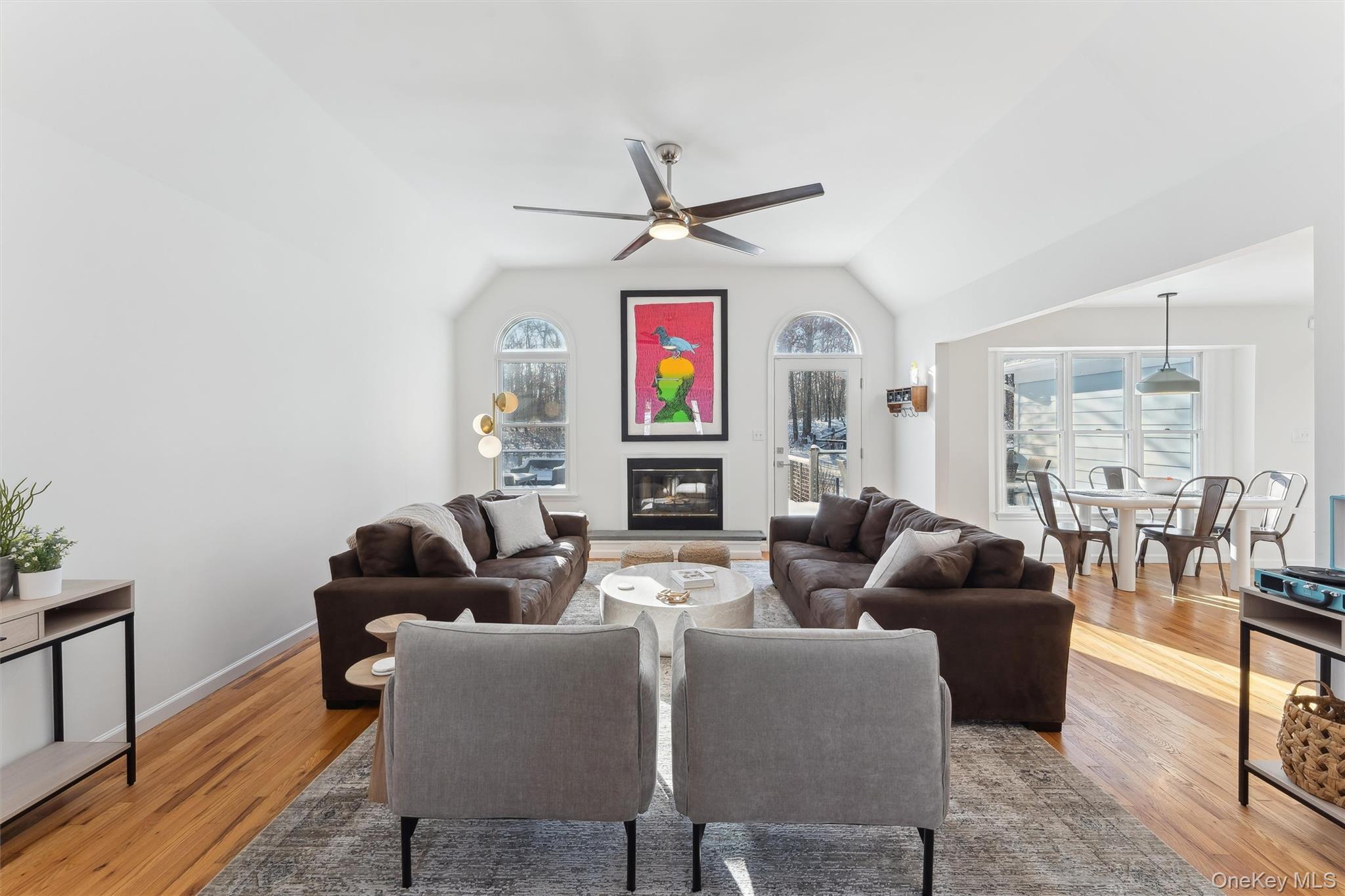 14 Hildreth Road Hampton Bays, NY 11946 - Photo 5 of 29 Living area with a ceiling fan,wood flooring, a fireplace, and vaulted ceiling