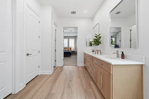 a bathroom with a sink and mirror