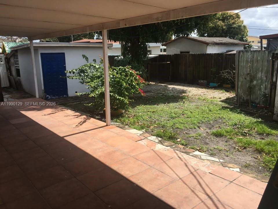 625 East 8th Court Hialeah, FL 33010 - Photo 13 of 18 a view of a house with a yard