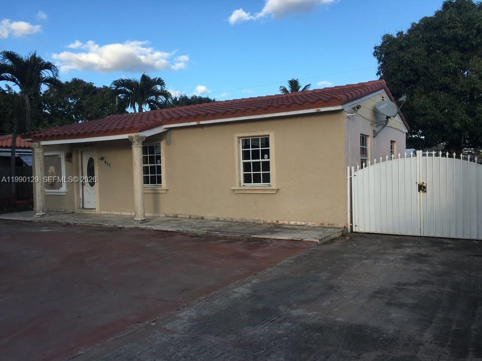 625 East 8th Court Hialeah, FL 33010 - Photo 2 of 18 a view of a house with a backyard