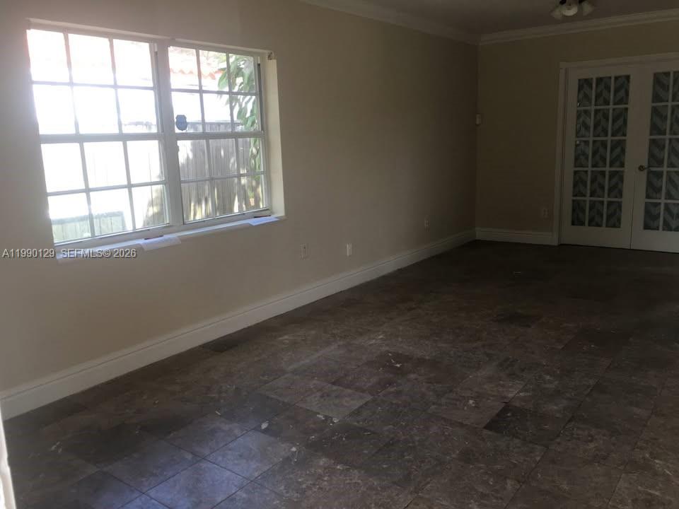 625 East 8th Court Hialeah, FL 33010 - Photo 4 of 18 an empty room with a window