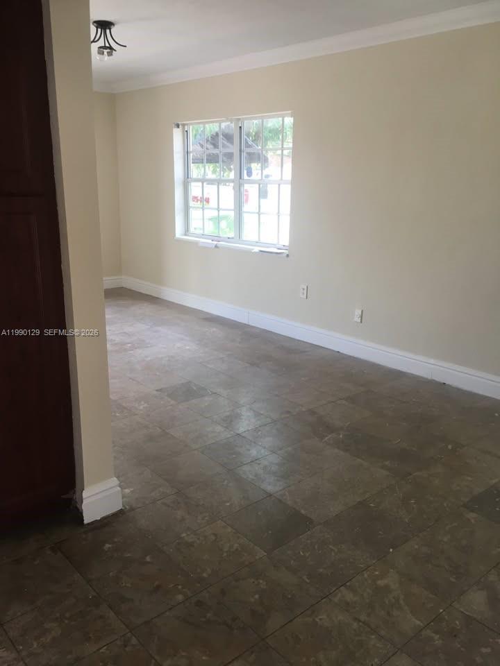 625 East 8th Court Hialeah, FL 33010 - Photo 6 of 18 an empty room with windows