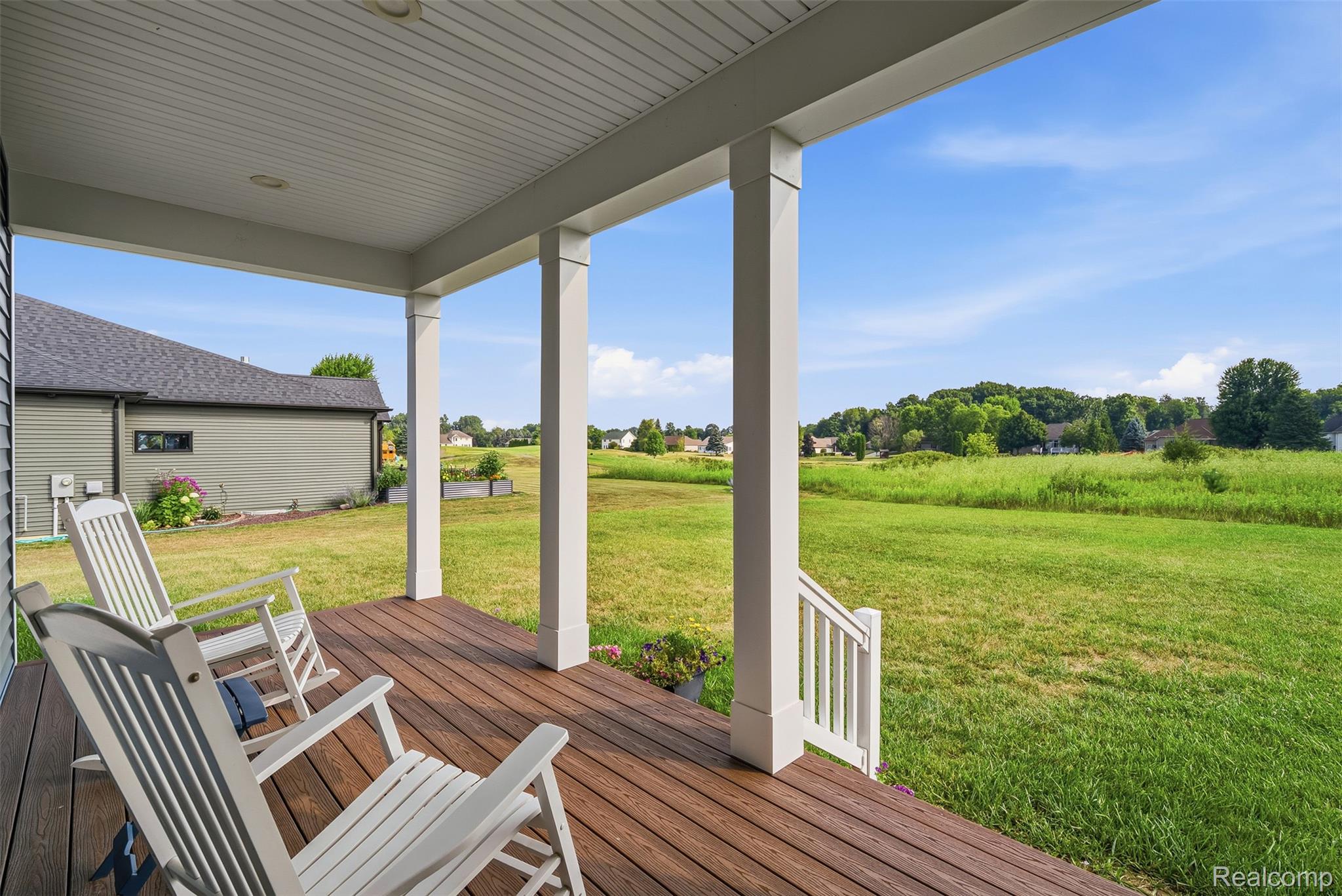 9087 Copper Ridge Drive Davison, MI 48423 - Photo 43 of 46 Covered back porch featuring wood-finish decking and white support columns
