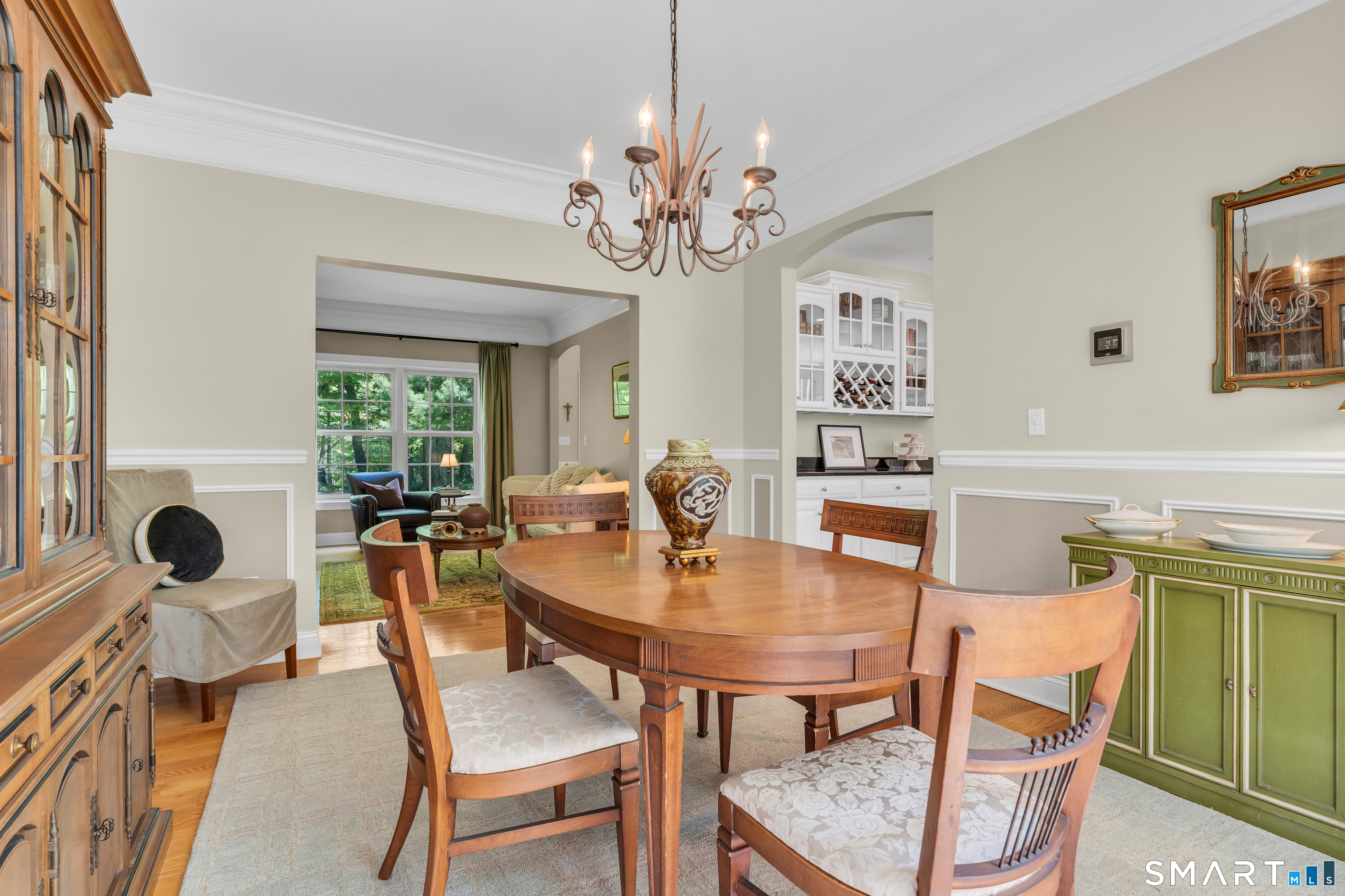 474 State Street Guilford, CT 06437 - Photo 10 of 40 a view of a dining room with furniture and a chandelier