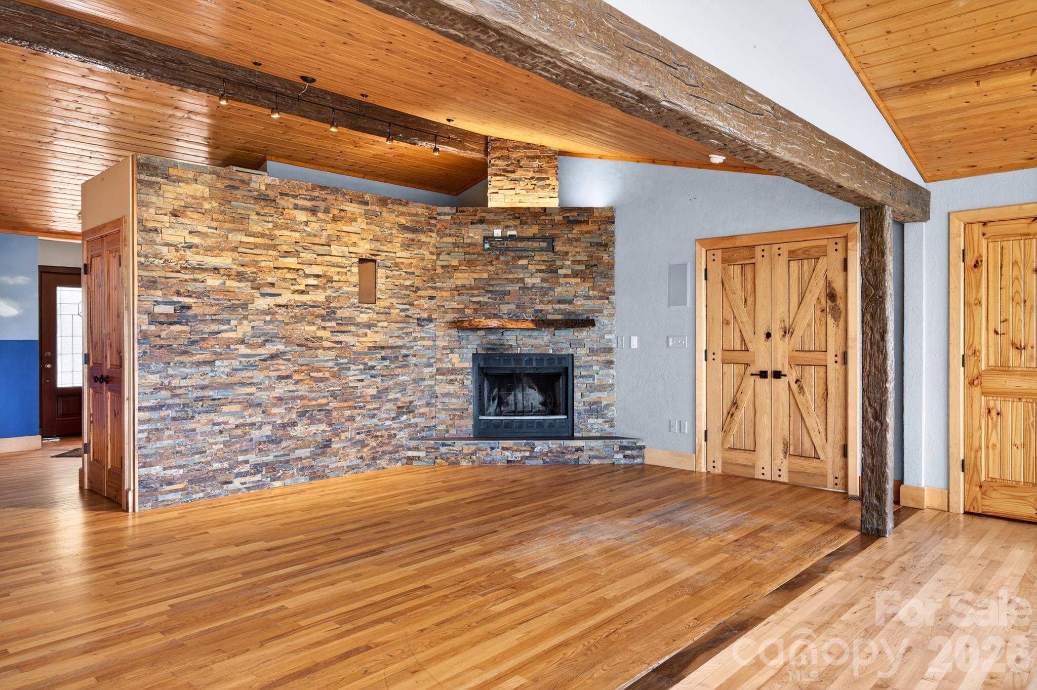 38 Lookout Road Asheville, NC 28804 - Photo 15 of 34 a view of an empty room with wooden floor and a window