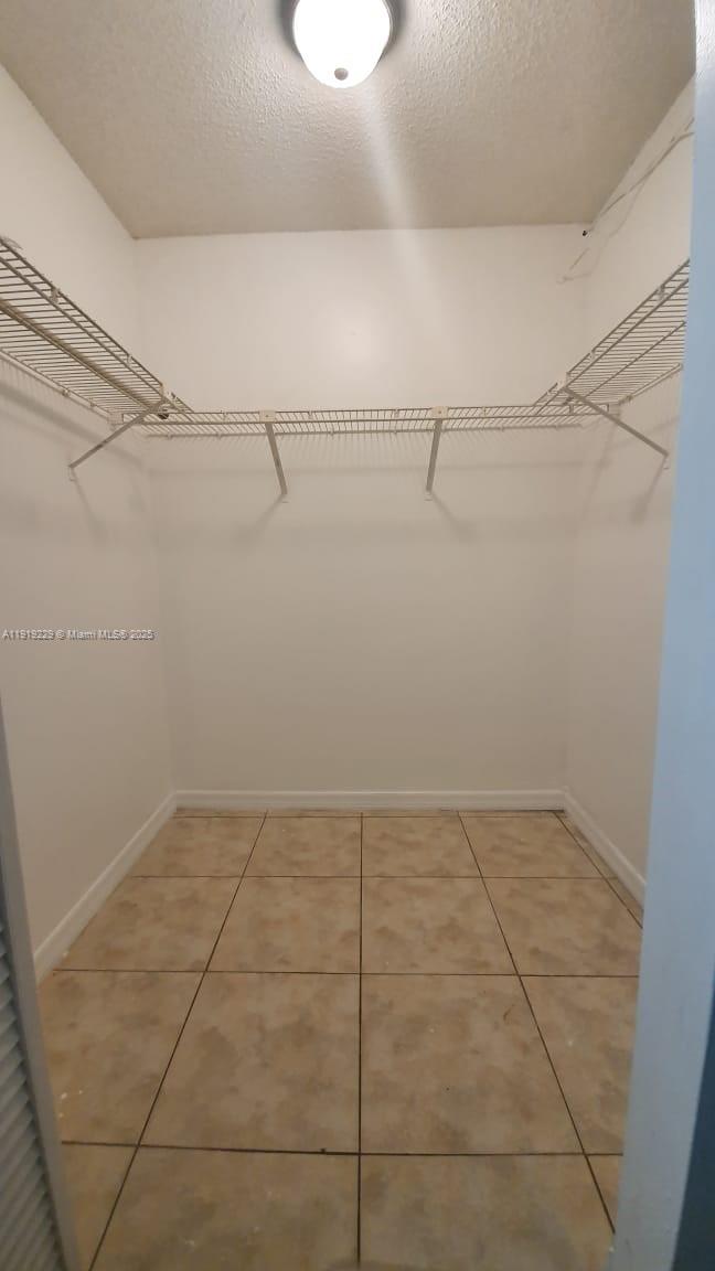 17021 North Bay Road, Unit 316 Sunny Isles Beach, FL 33160 - Photo 15 of 19 a view of a room with racks on the wall