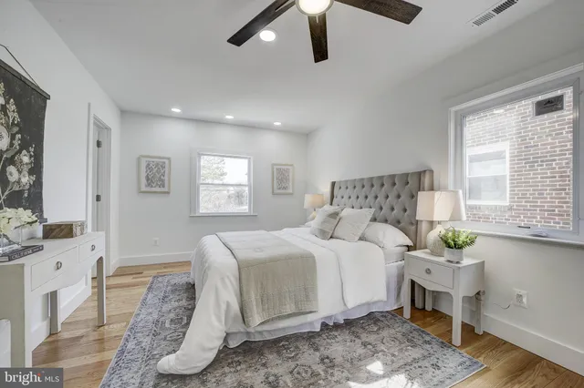 a bedroom with a large bed and a window