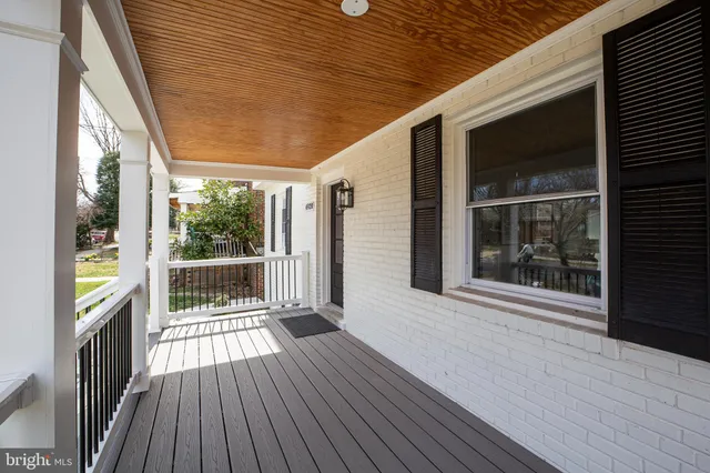 a porch with wooden floor and outdoor space