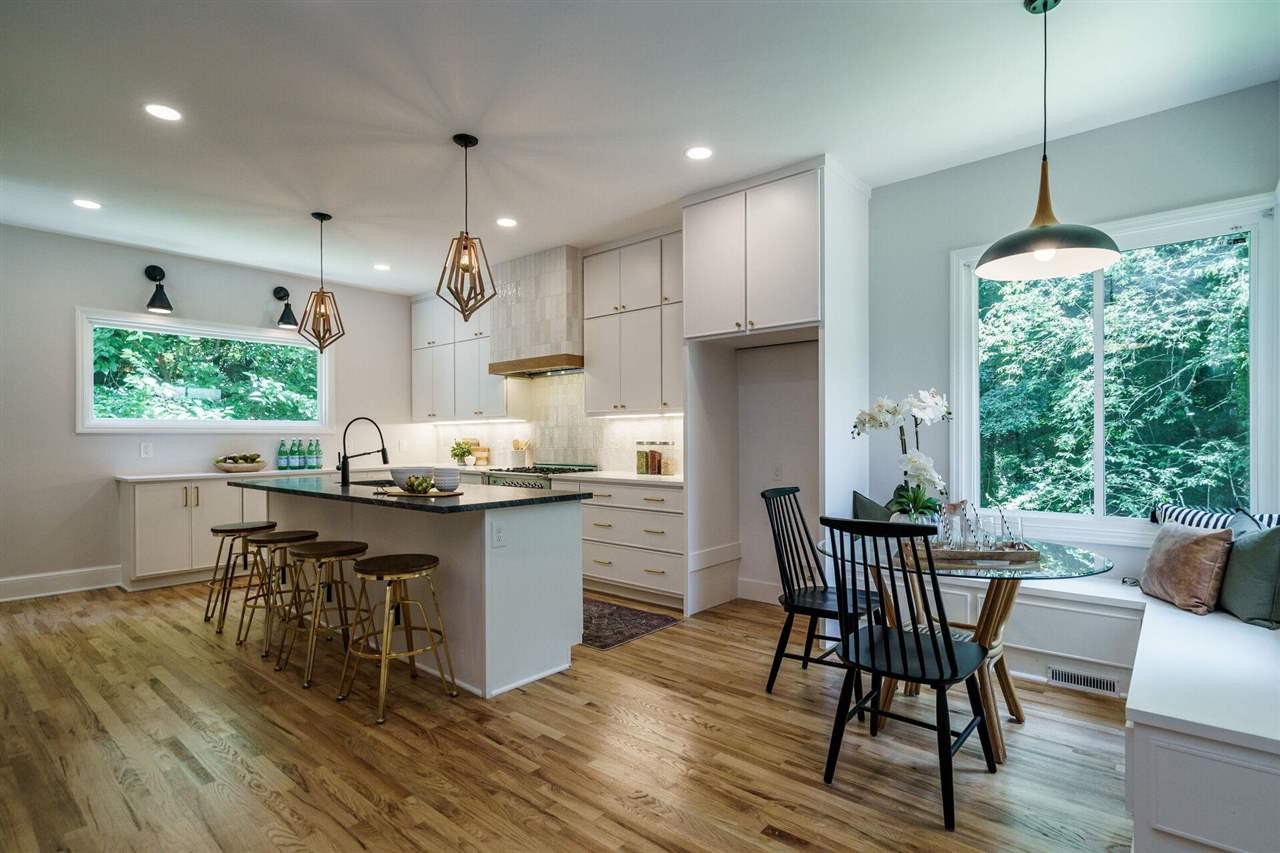2005 Banbury Road Raleigh, NC 27608 - Photo 4 of 30 Light-Filled Kitchen opens to a casual dining area with Banquette overlooking the private gardens. Kitchen - Breakfast Room with Banquette