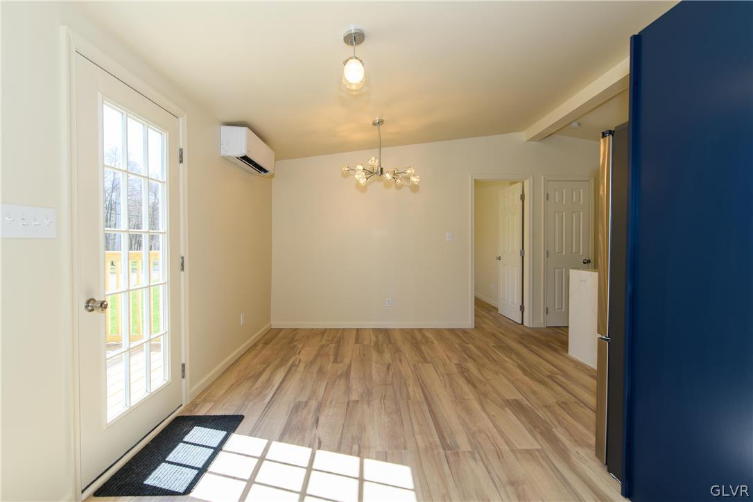 396 Swamp Road Wind Gap, PA 18091 - Photo 18 of 50 wooden floor in an empty room with a window
