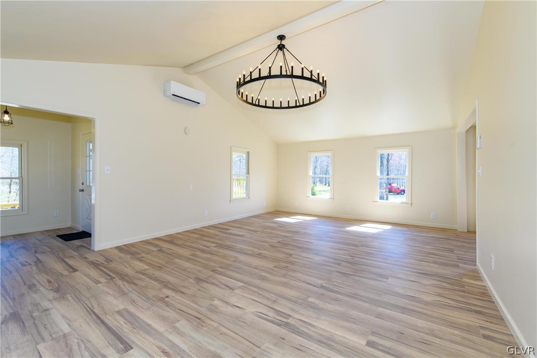 396 Swamp Road Wind Gap, PA 18091 - Photo 19 of 50 an empty room with wooden floor and windows