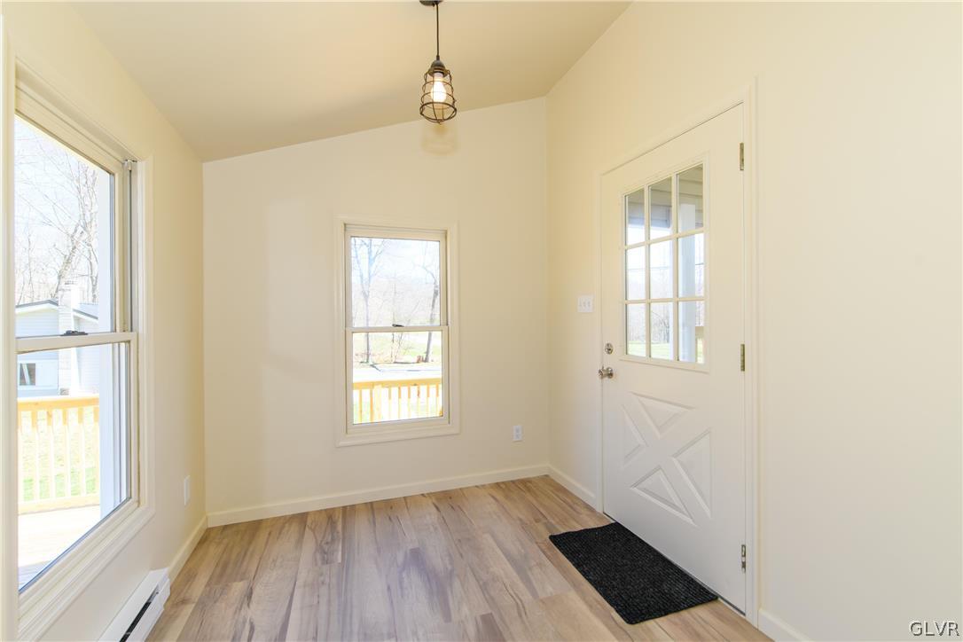 396 Swamp Road Wind Gap, PA 18091 - Photo 21 of 50 a view of an empty room with wooden floor and a window