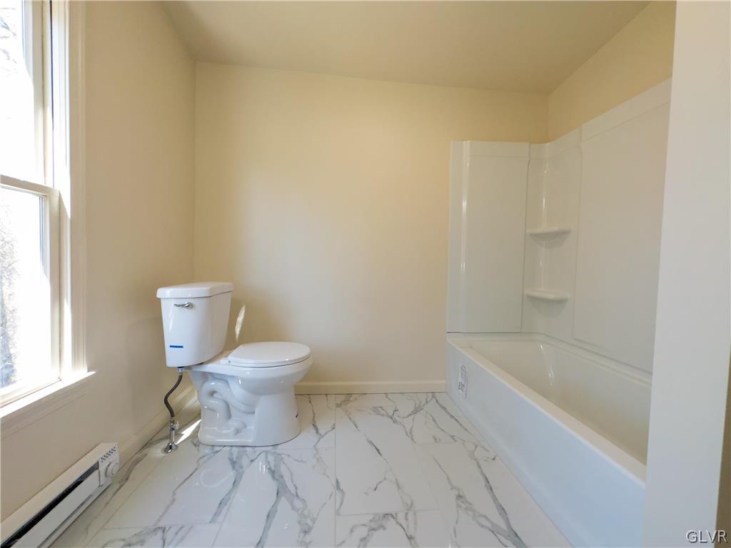 396 Swamp Road Wind Gap, PA 18091 - Photo 25 of 50 a bathroom with a toilet a sink and bathtub