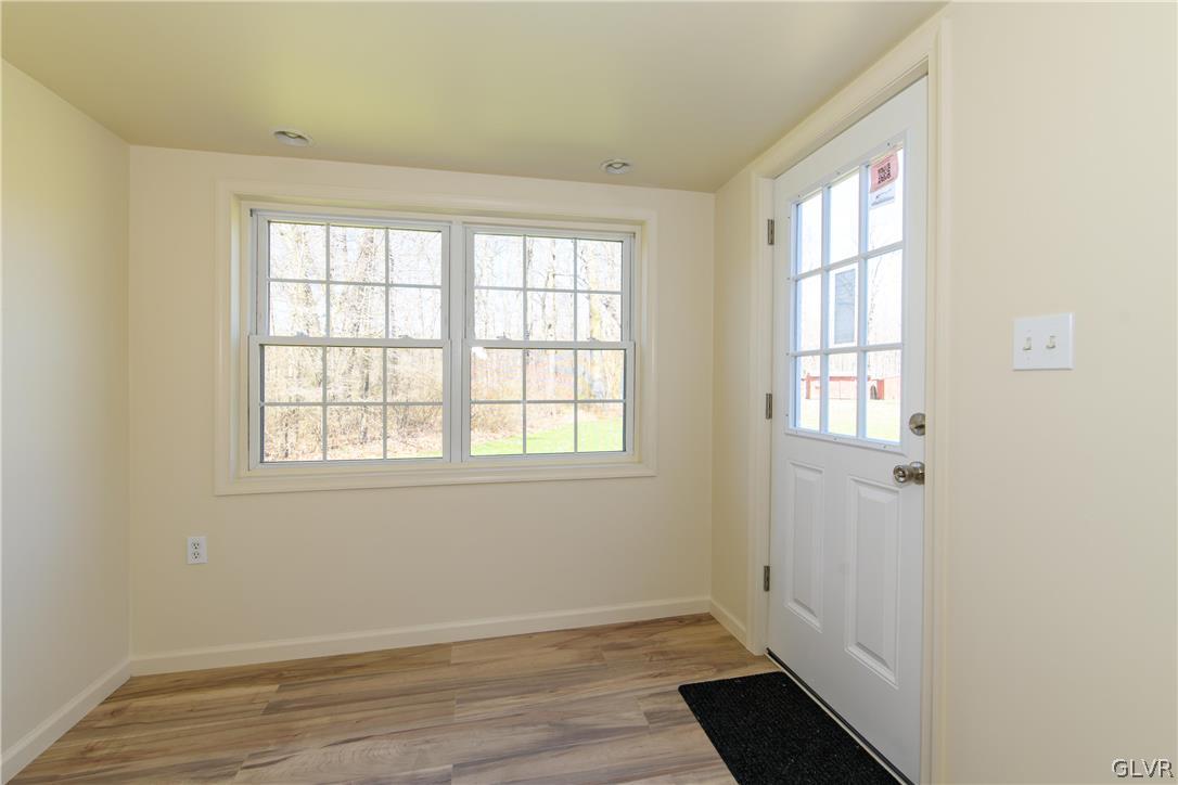 396 Swamp Road Wind Gap, PA 18091 - Photo 26 of 50 an empty room with wooden floor and windows