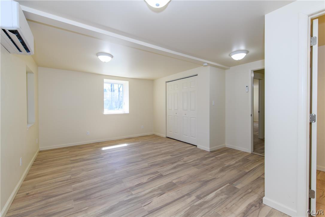 396 Swamp Road Wind Gap, PA 18091 - Photo 28 of 50 a view of an empty room with wooden floor and a window