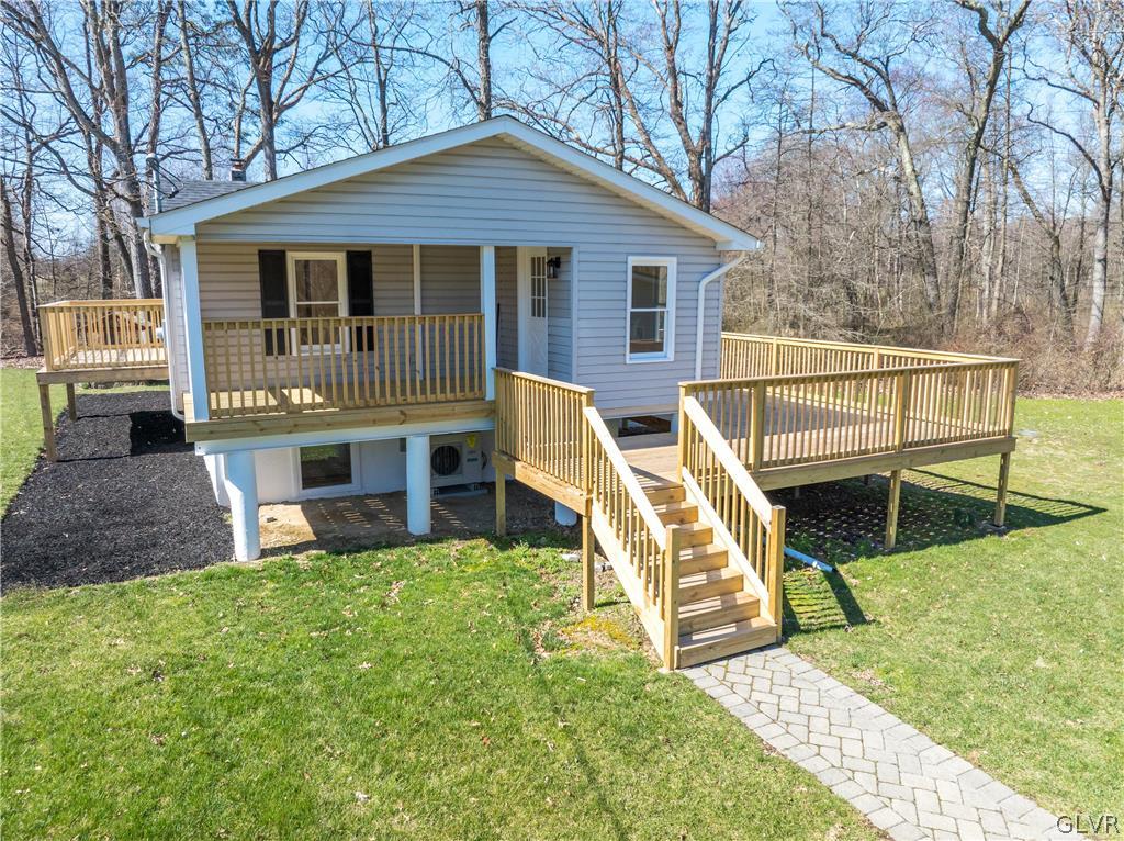 396 Swamp Road Wind Gap, PA 18091 - Photo 4 of 50 a view of a house with a yard porch and wooden fence