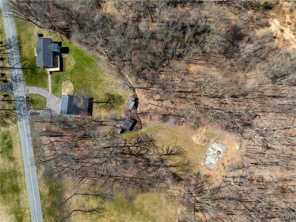396 Swamp Road Wind Gap, PA 18091 - Photo 44 of 50 a backyard of a building with large trees