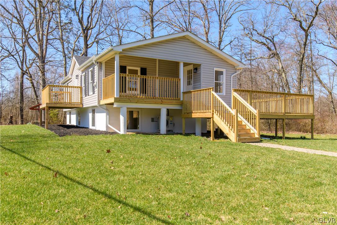 396 Swamp Road Wind Gap, PA 18091 - Photo 8 of 50 a view of a house with a big yard and large trees