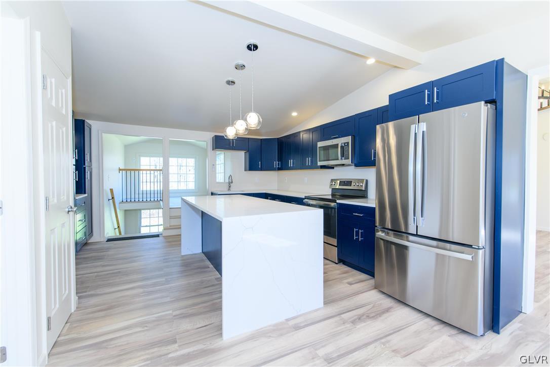 396 Swamp Road Wind Gap, PA 18091 - Photo 9 of 50 a kitchen with refrigerator cabinets and wooden floor