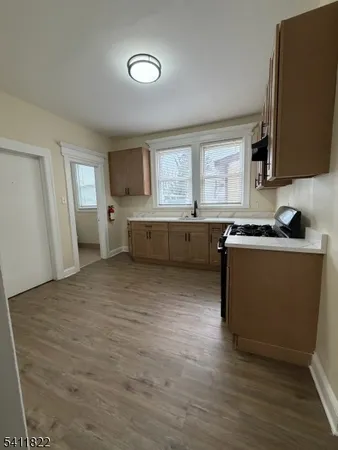 a view of a kitchen with a sink cabinets and a window