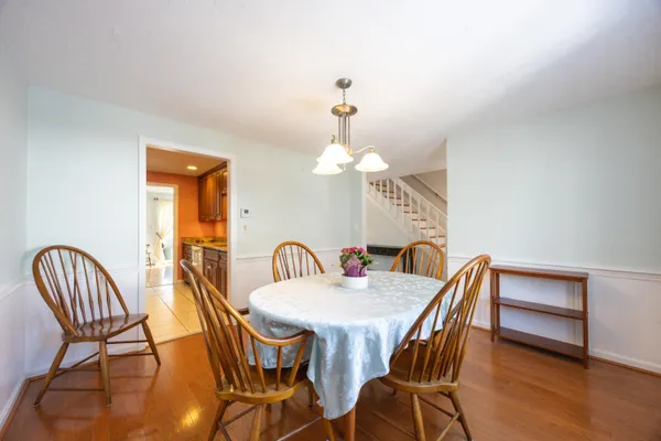 a view of a dining room with furniture and wooden floor