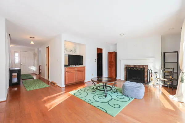 a living room with furniture fireplace and flat screen tv