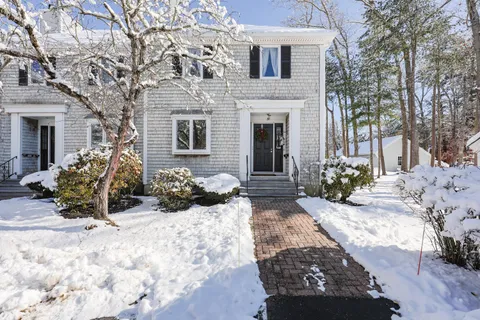 a view of a house with a snow in front of house