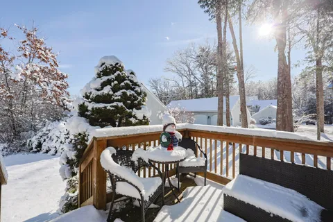 a view of a balcony with a table and chairs