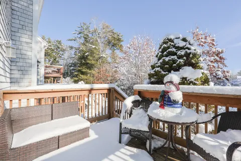 a front view of a house with a potted plant