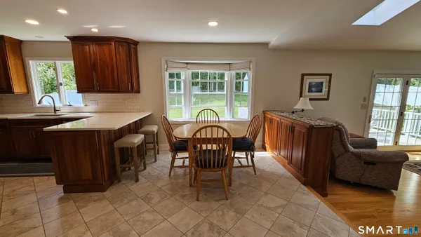 a view of a dining room with furniture and window