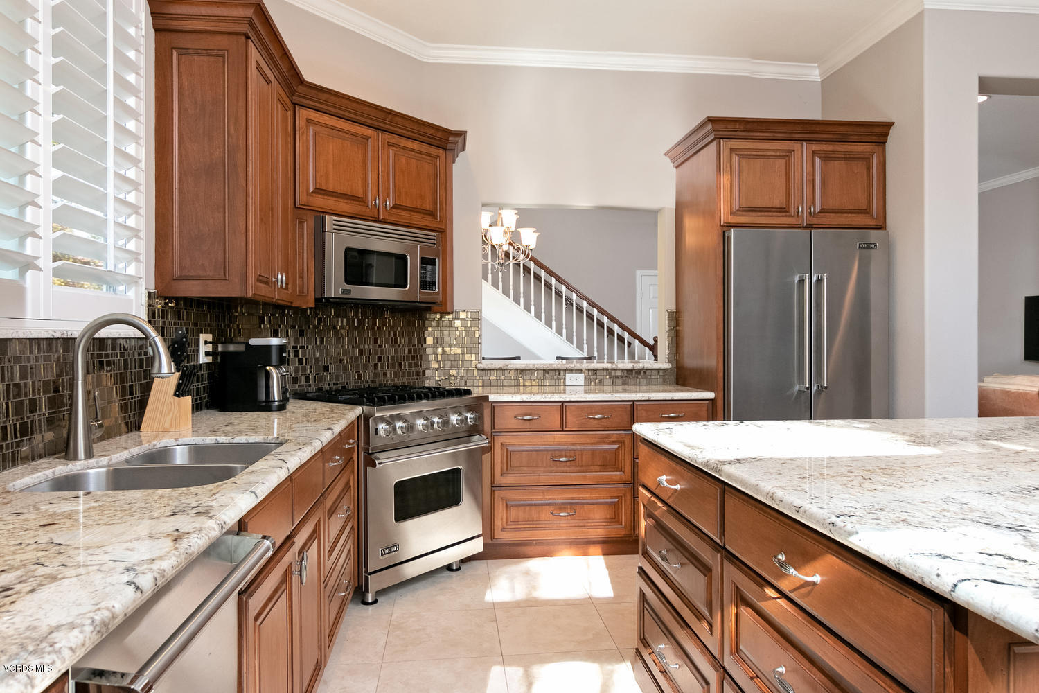 1121 Corte Riviera Camarillo, CA 93010 - Photo 12 of 35 a kitchen with granite countertop a stove a sink and a microwave