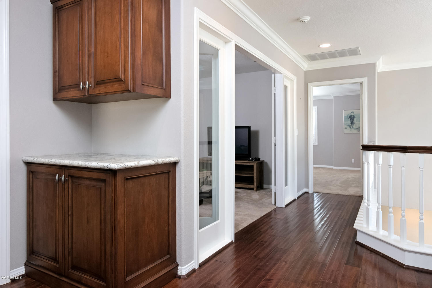 1121 Corte Riviera Camarillo, CA 93010 - Photo 15 of 35 a view of a hallway with wooden floor and staircase