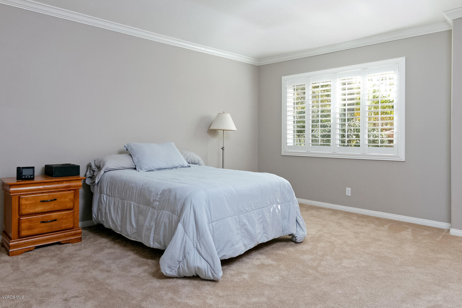 1121 Corte Riviera Camarillo, CA 93010 - Photo 16 of 35 a bedroom with a bed and a window