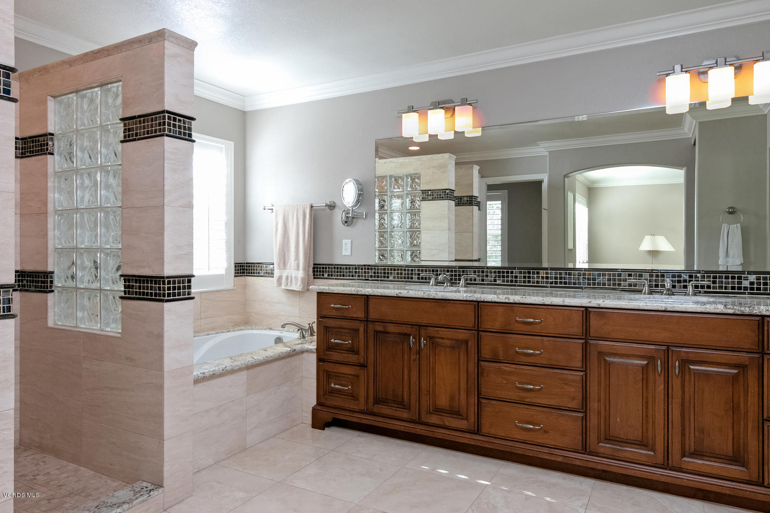 1121 Corte Riviera Camarillo, CA 93010 - Photo 18 of 35 a spacious bathroom with a granite countertop double vanity sink a mirror and a bathtub
