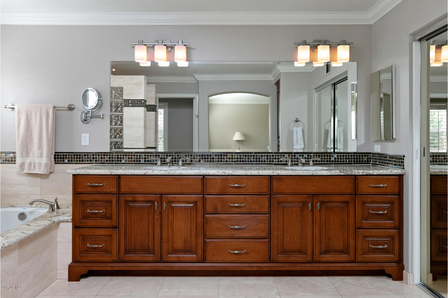 1121 Corte Riviera Camarillo, CA 93010 - Photo 19 of 35 a bathroom with a granite countertop sink and a mirror