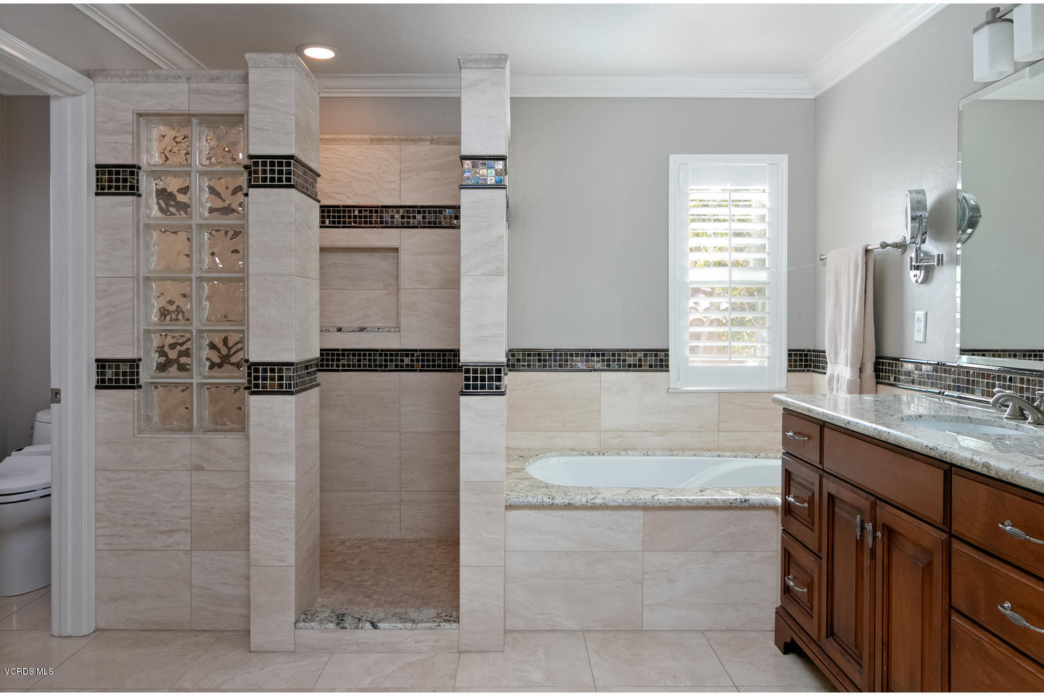 1121 Corte Riviera Camarillo, CA 93010 - Photo 20 of 35 a bathroom with a granite countertop sink a mirror and shower