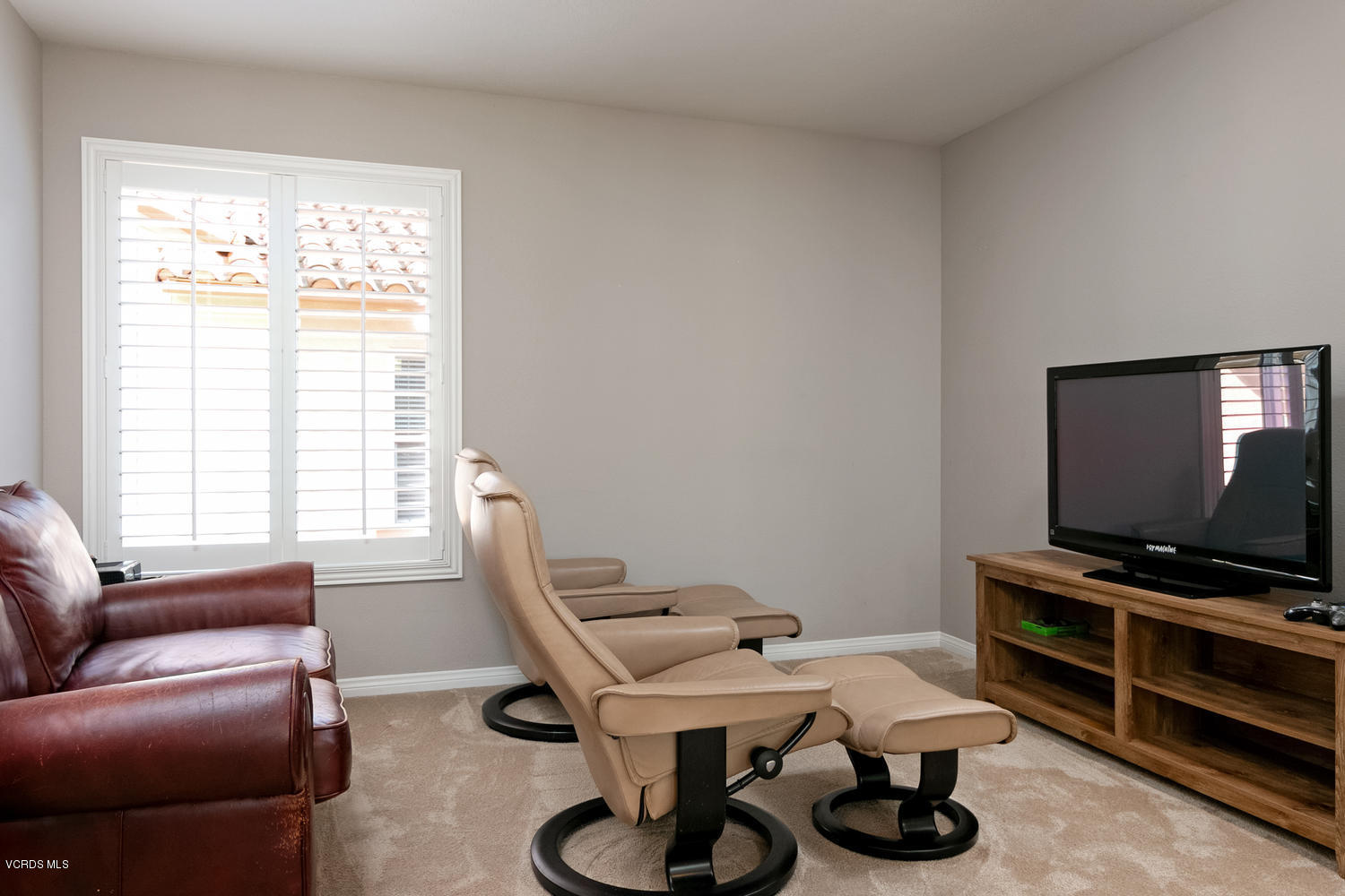 1121 Corte Riviera Camarillo, CA 93010 - Photo 21 of 35 a work room with furniture a flat screen tv and a window