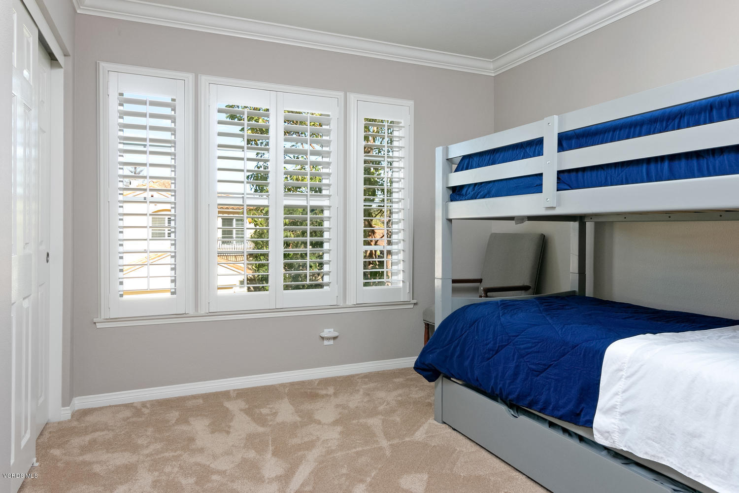 1121 Corte Riviera Camarillo, CA 93010 - Photo 23 of 35 a bedroom with a bed and a window