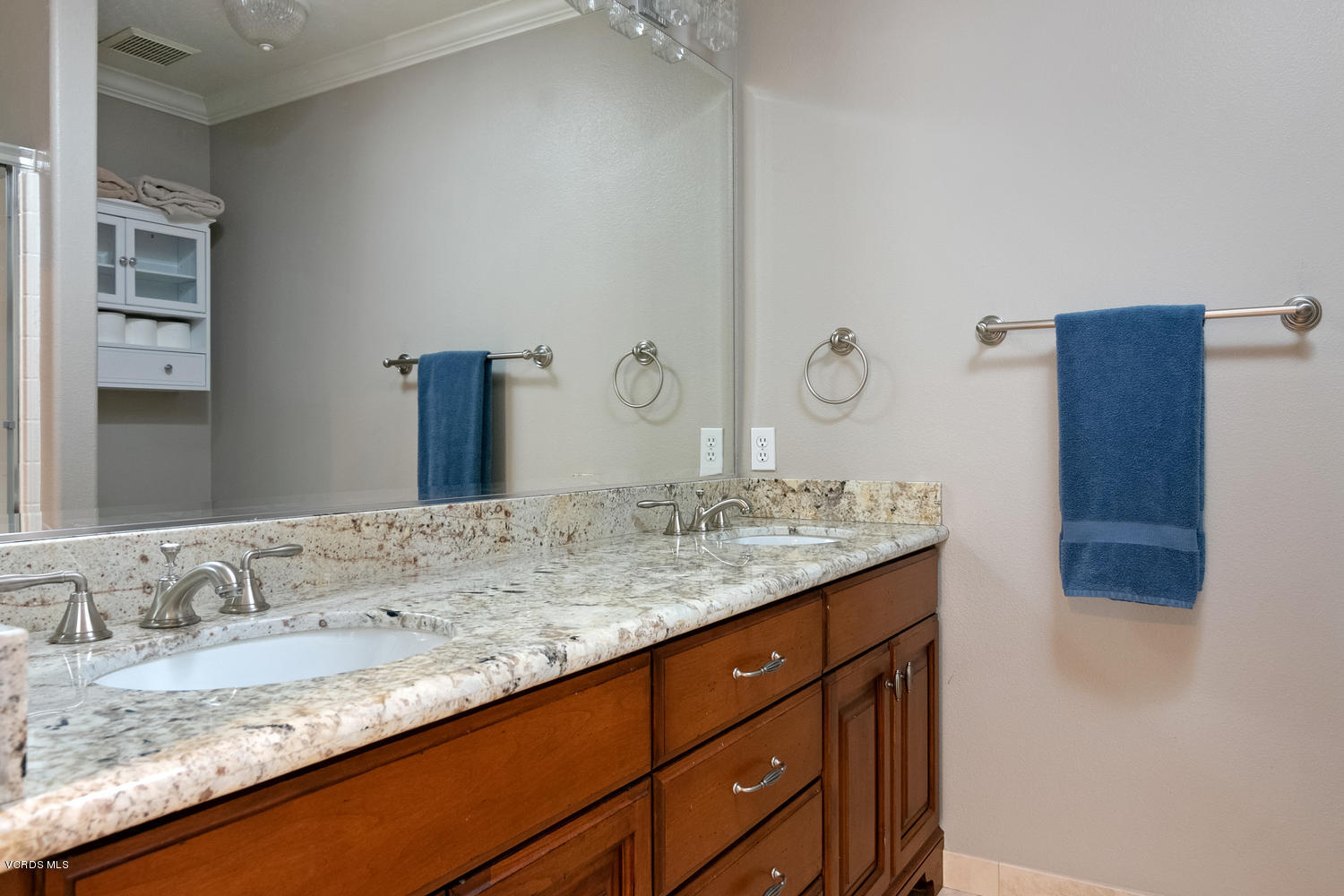 1121 Corte Riviera Camarillo, CA 93010 - Photo 24 of 35 a bathroom with a granite countertop sink and a mirror