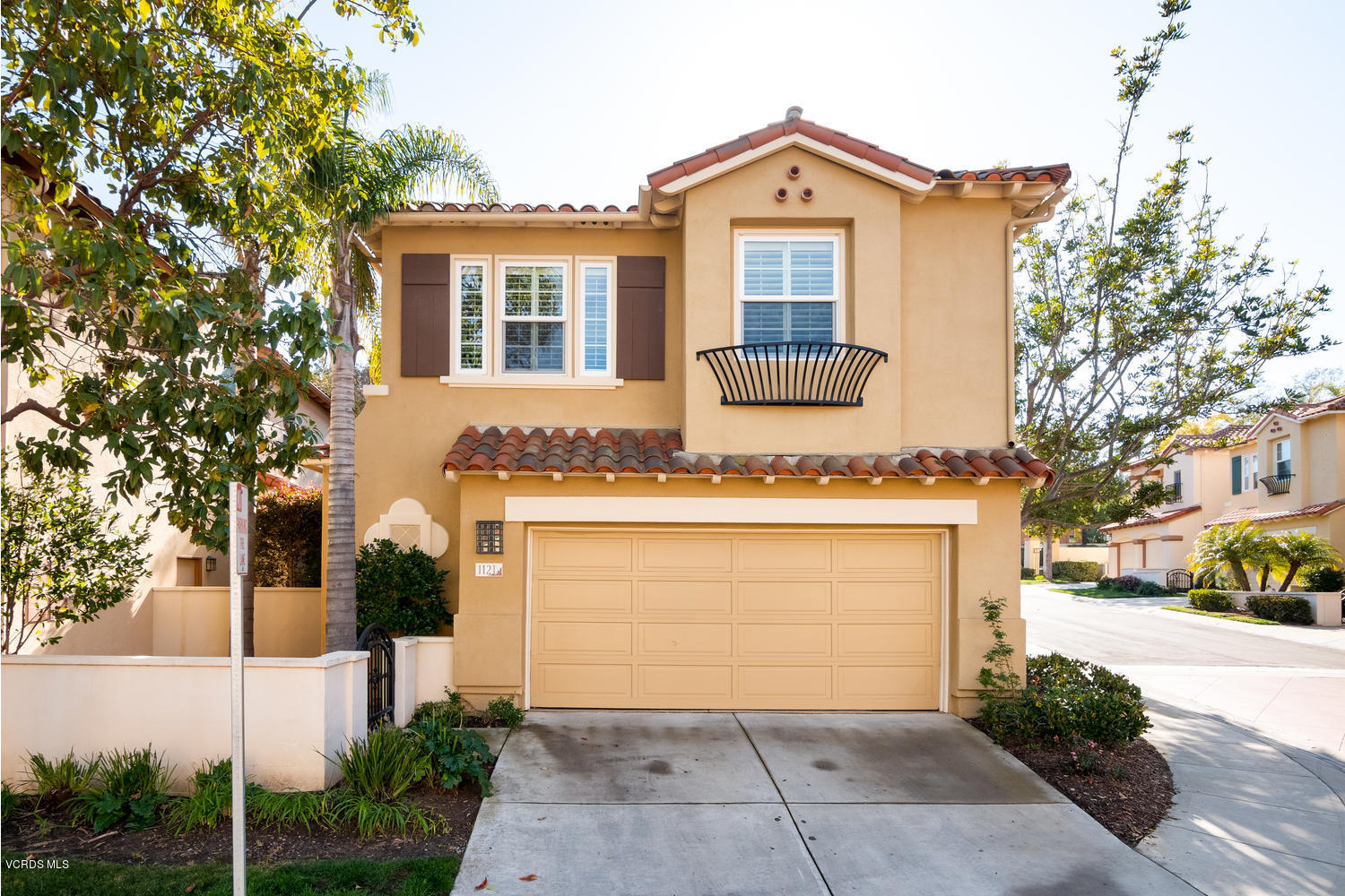 1121 Corte Riviera Camarillo, CA 93010 - Photo 34 of 35 a front view of a house with a yard and garage